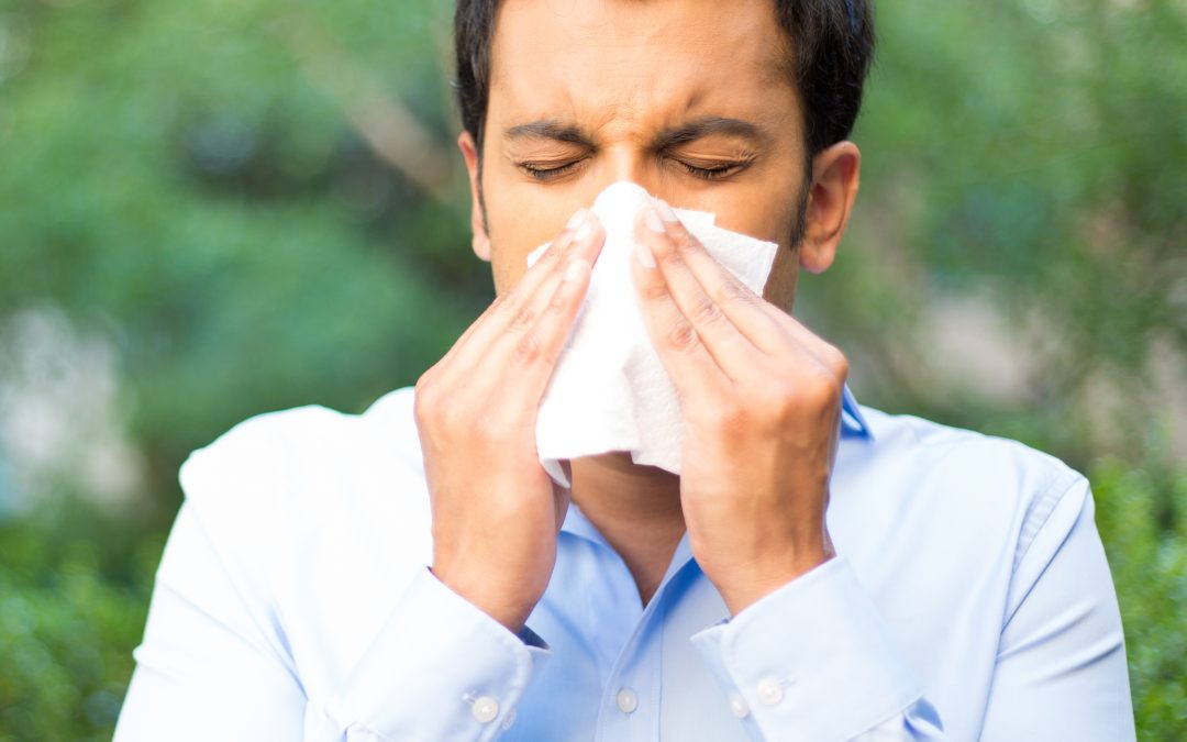 Man dealing with Seasonal Allergies